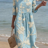 Blaues Sommerkleid mit floralen Akzenten